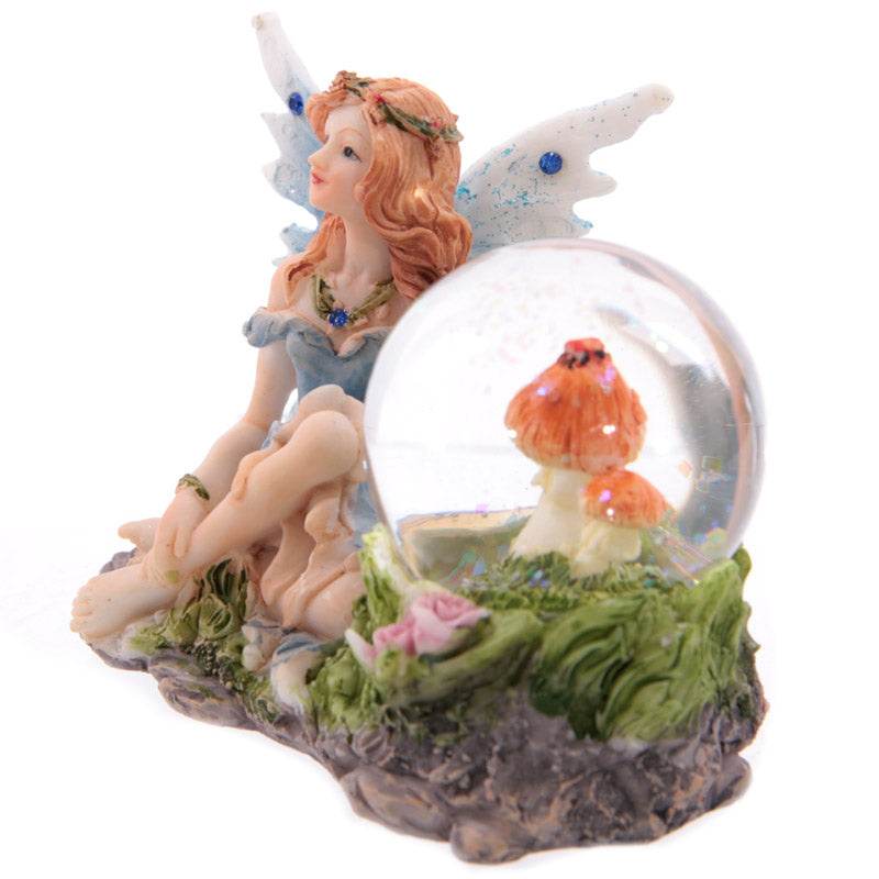 Flower Fairy Sitting Snow Globe - Gift Arch